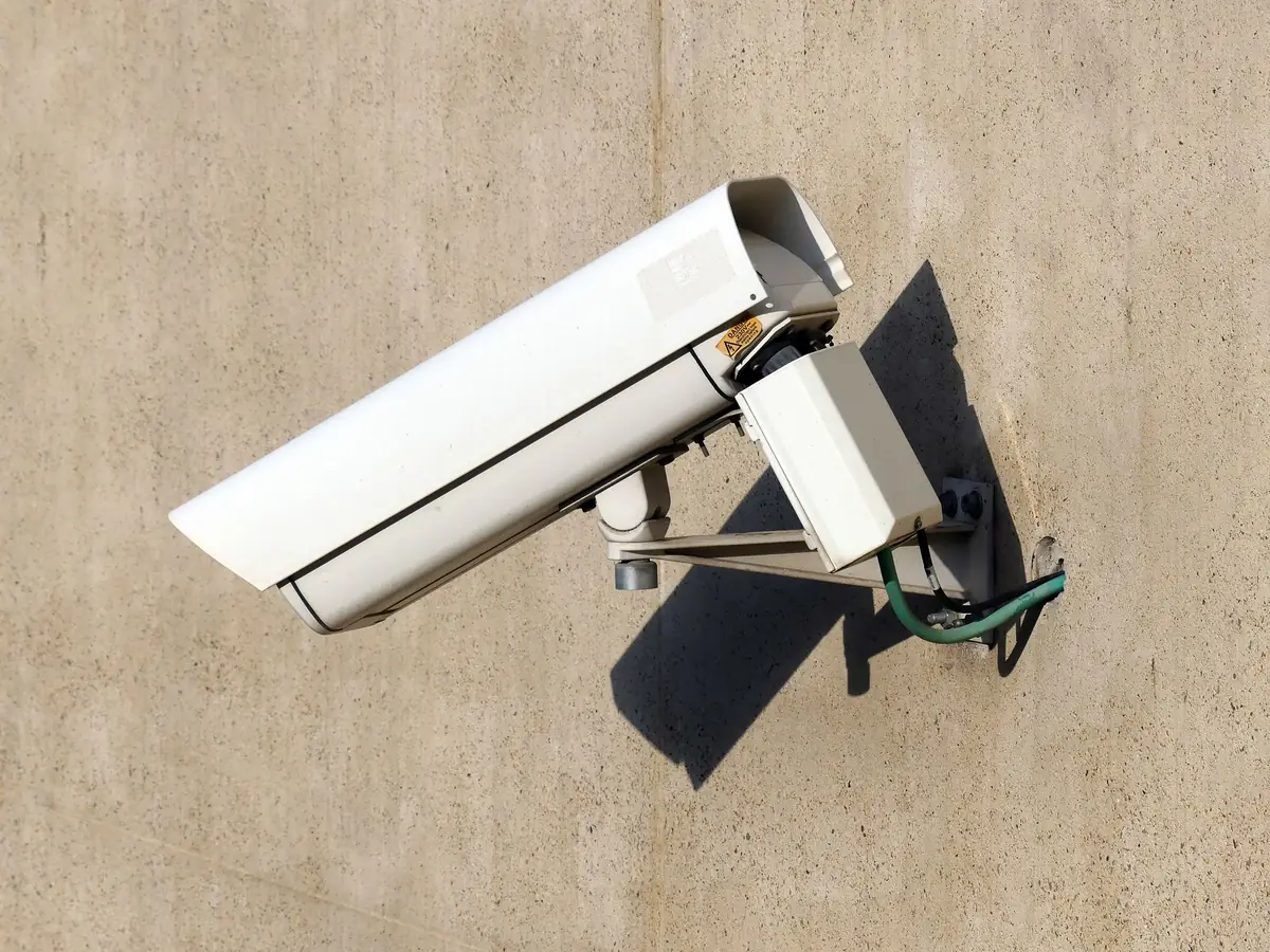 Al Nafeh technician installing a CCTV camera outside a Dubai villa