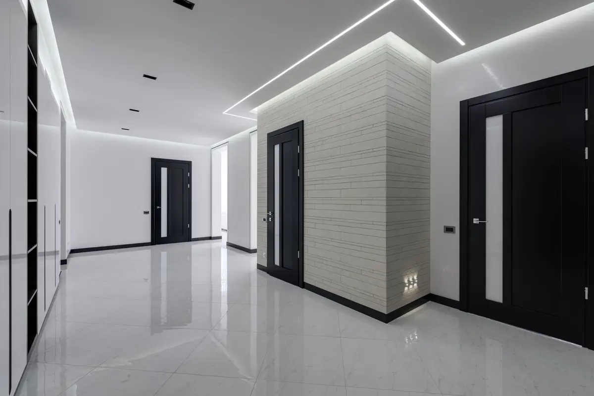 Al Nafeh technician installing a gypsum false ceiling in a Dubai office